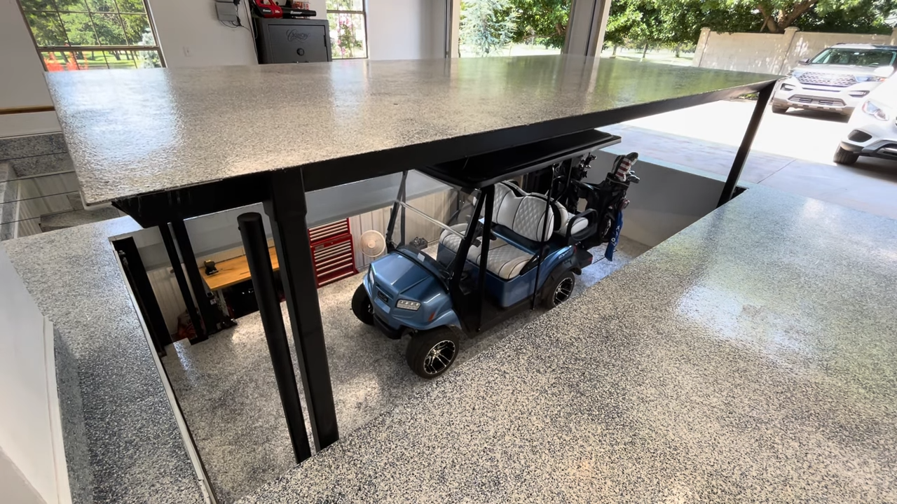Storage Lift Lowers Golf Cart to Secure Lower Level in Homeowners Garage - Vasari Lifts